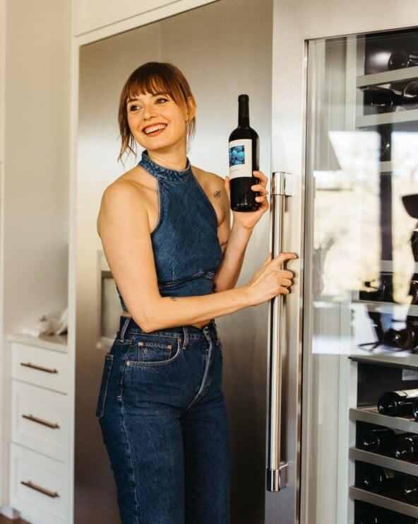 woman with wine for first time dinner party