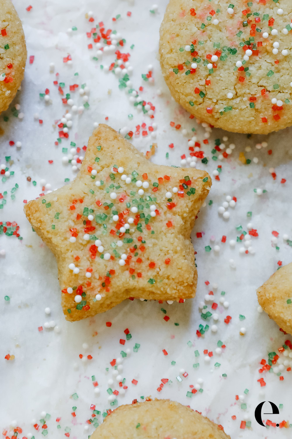 star shapes almond flour christmas cookie with red and green sprinkles
