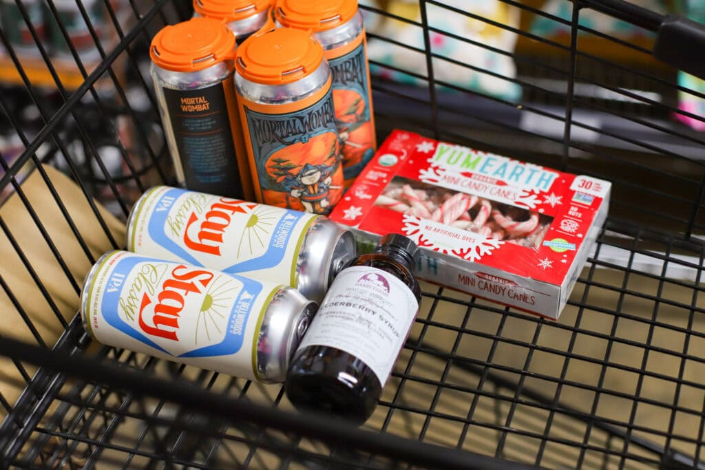 cart with items cart of beer, elderberry, and candy canes