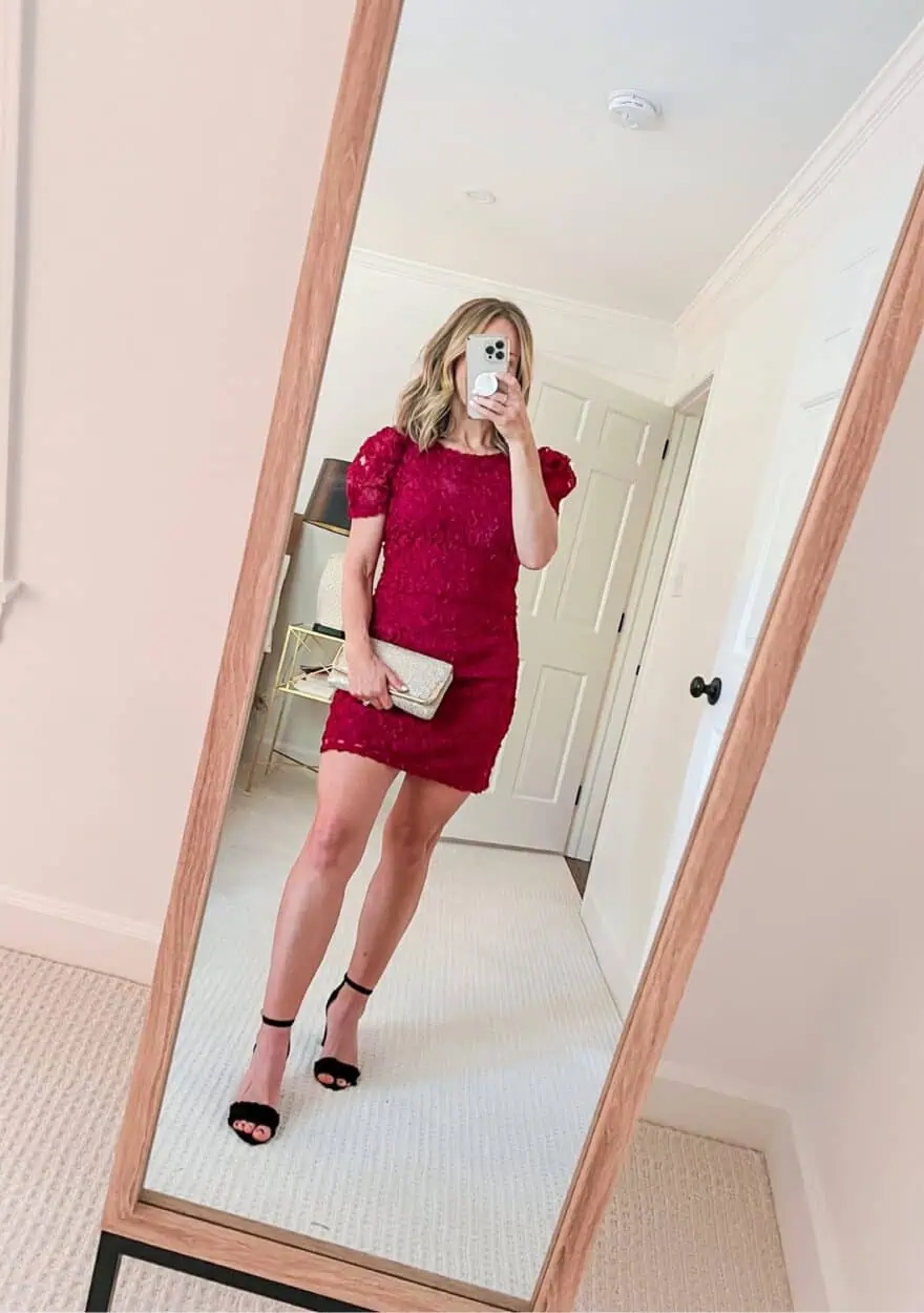 Woman wearing Always For You Wine Red Puff Sleeve Mini Dress with clutch